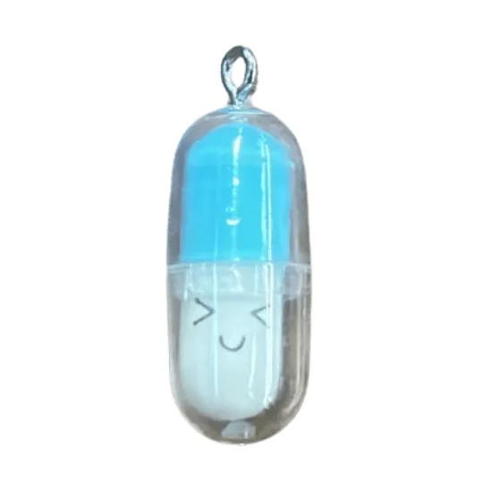 Plastic Happy pill pendant